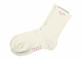 with an embroidered pink quote which reads ‘Keep Going; the designers favourite phrase